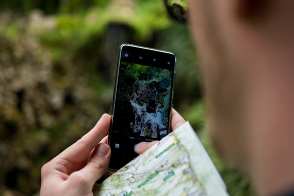 Hiker using GPS for trail navigation